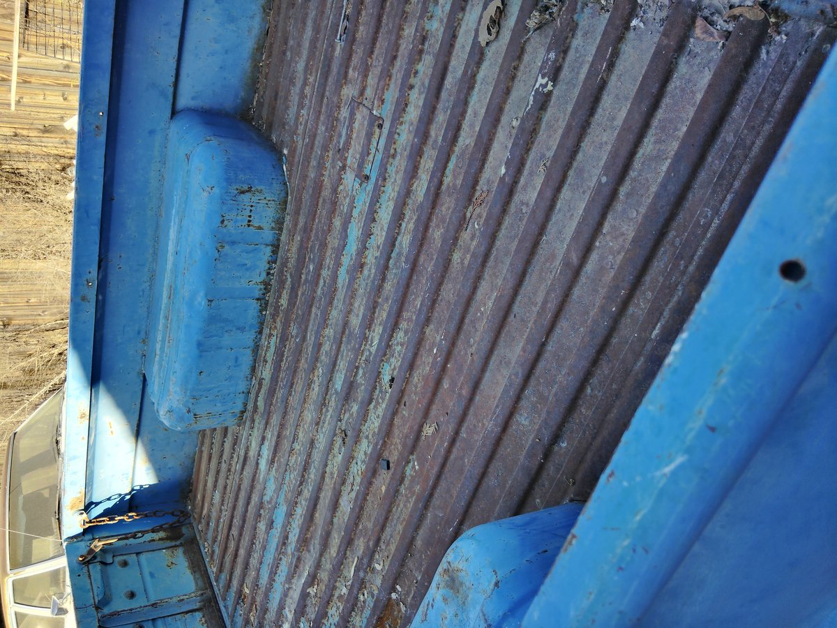 Blue truck bed rusted worn needs repair