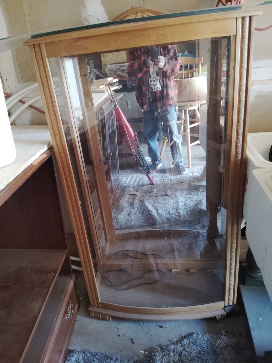 Wooden display cabinet with glass doors and shelves